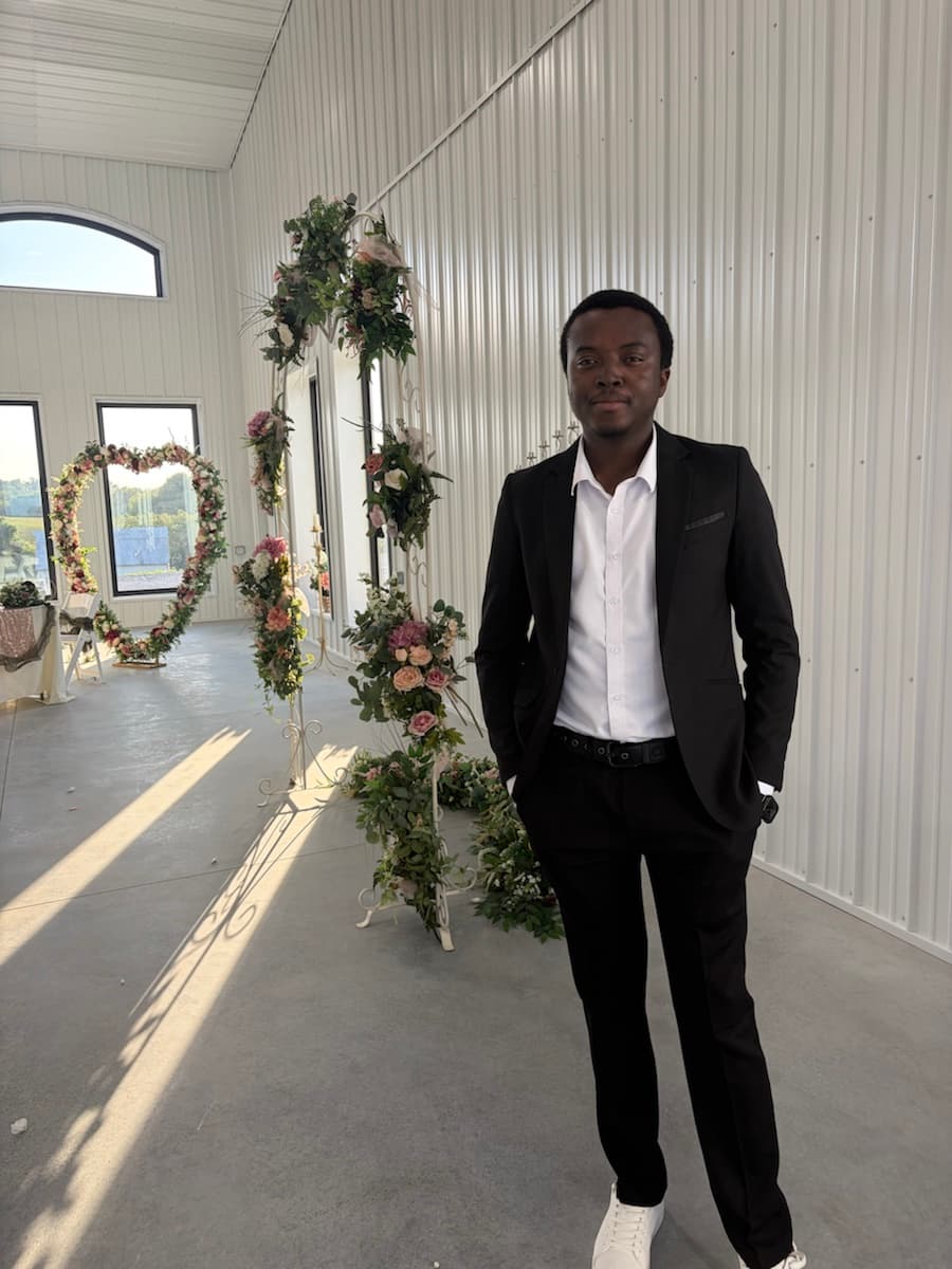 Eugene Lotsu in a black suit